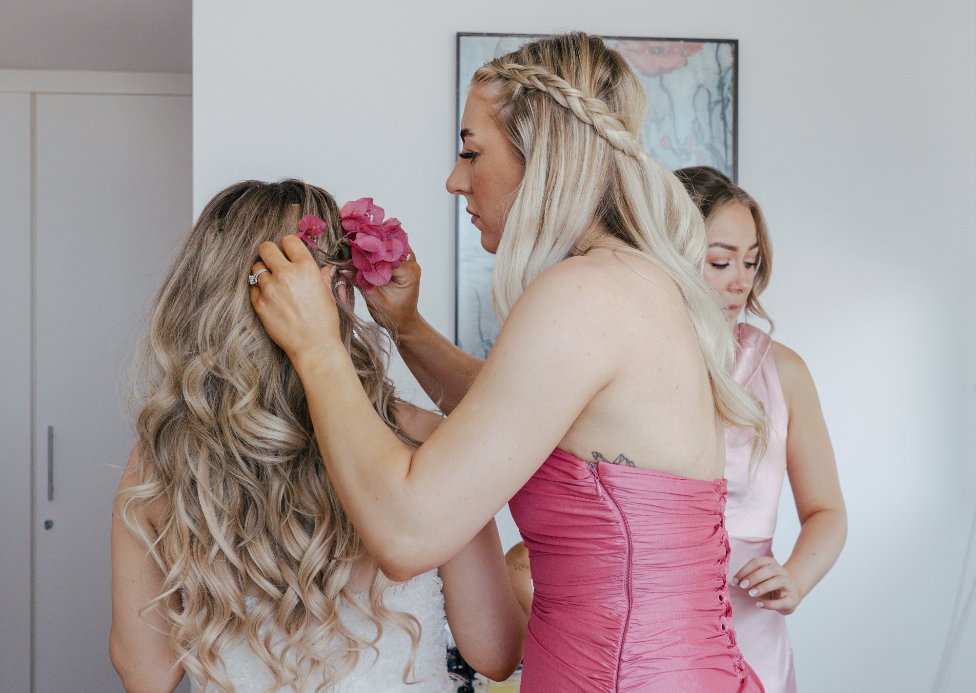 Bougainvillea blooms tucked into the bride's hair, Cabo de Gata, Mamma Mia wedding