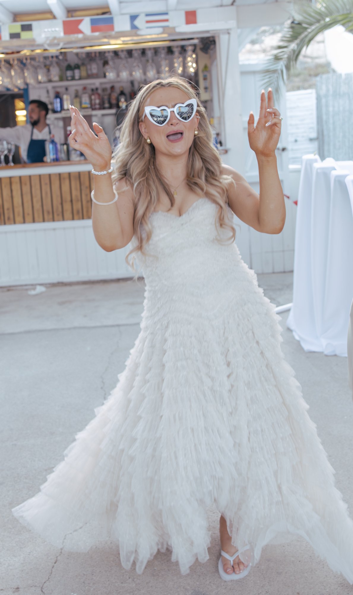 Bride dancing in her dress at the party, Agua Amarga, beach wedding