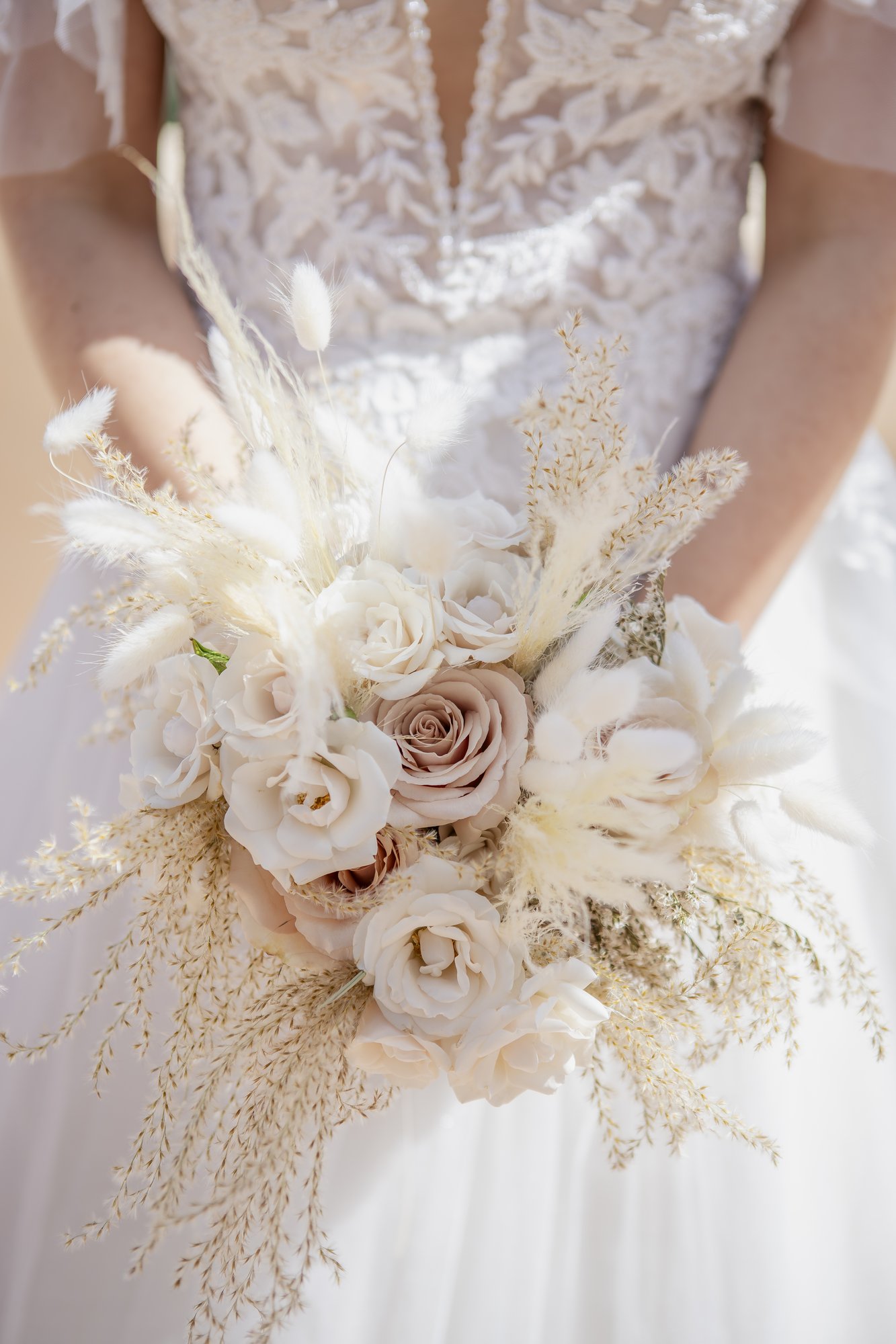 Blush and cream bouquet against the lace dress, boho wedding Agua Amarga