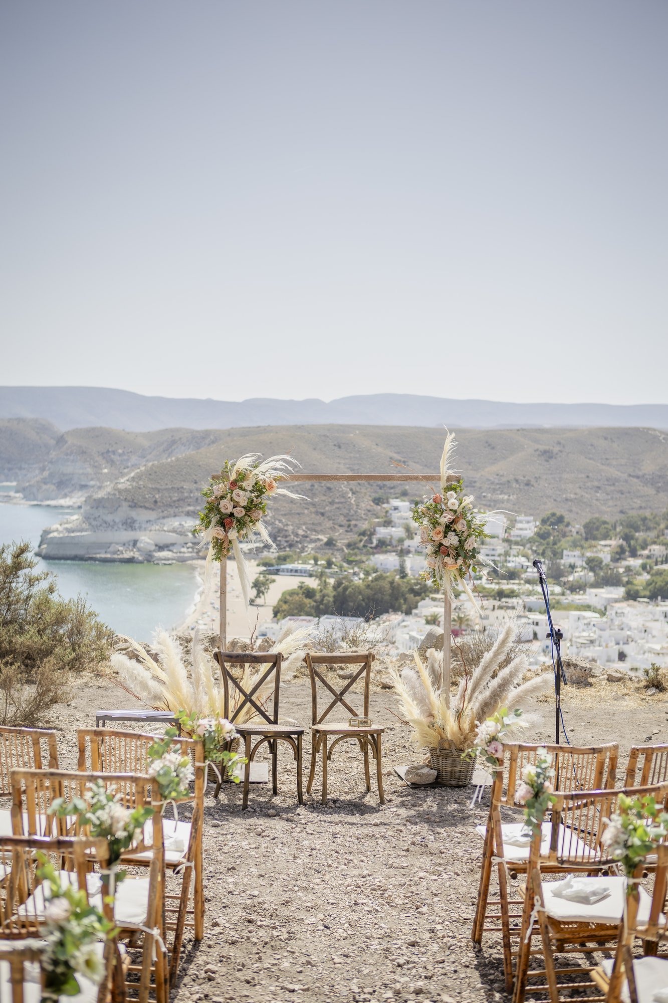 Ceremony arch with pampas grass above the bay, outdoor ceremony, wedding Agua Amarga