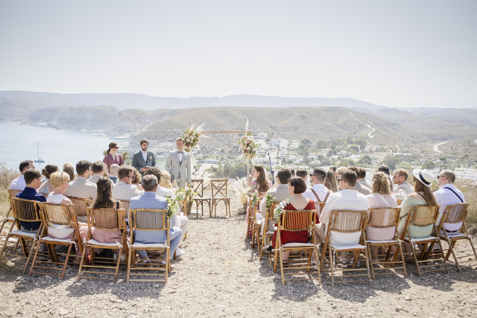 Guests at the outdoor ceremony with sea view, wedding Agua Amarga