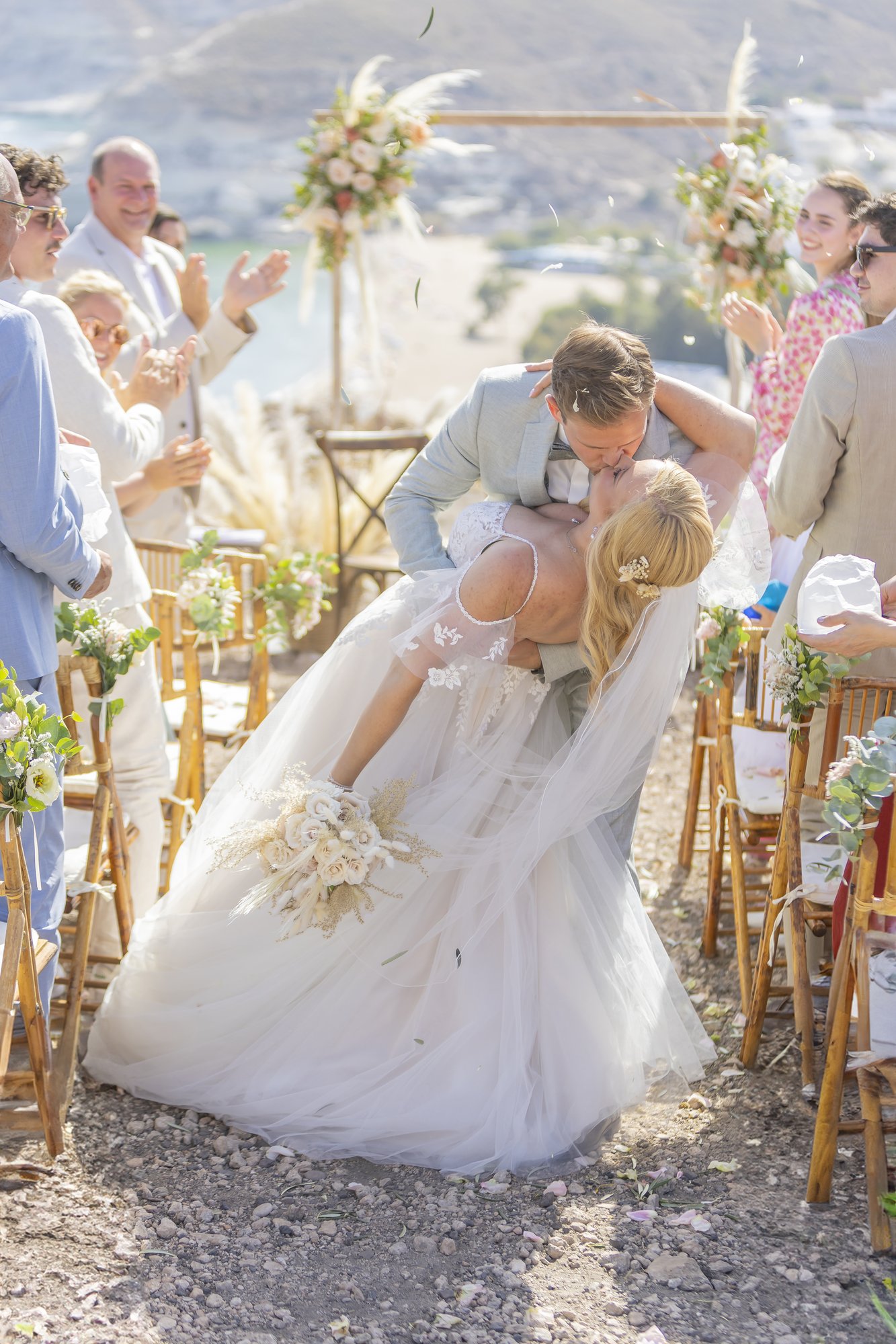Groom dipping the bride for a kiss in the aisle, wedding Agua Amarga