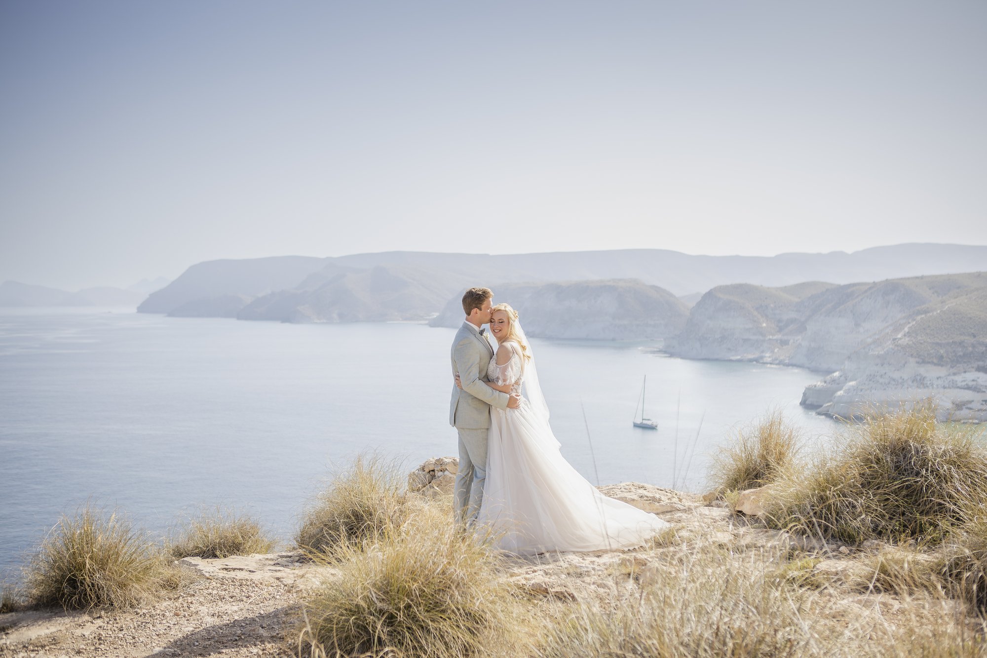 Couple on the cliff with a wide sea view, wedding Agua Amarga