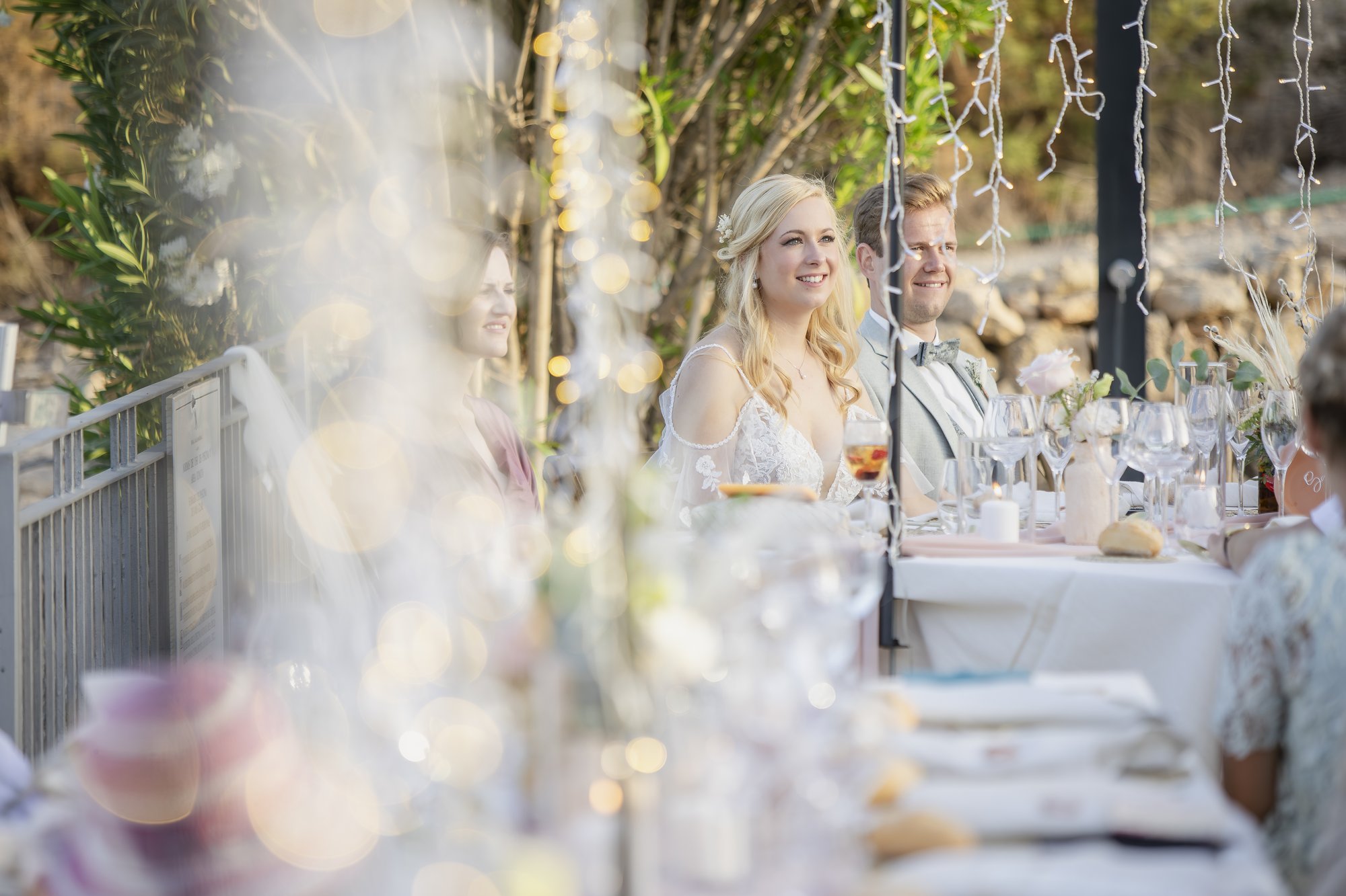 Bride at dinner among the lights, wedding Agua Amarga