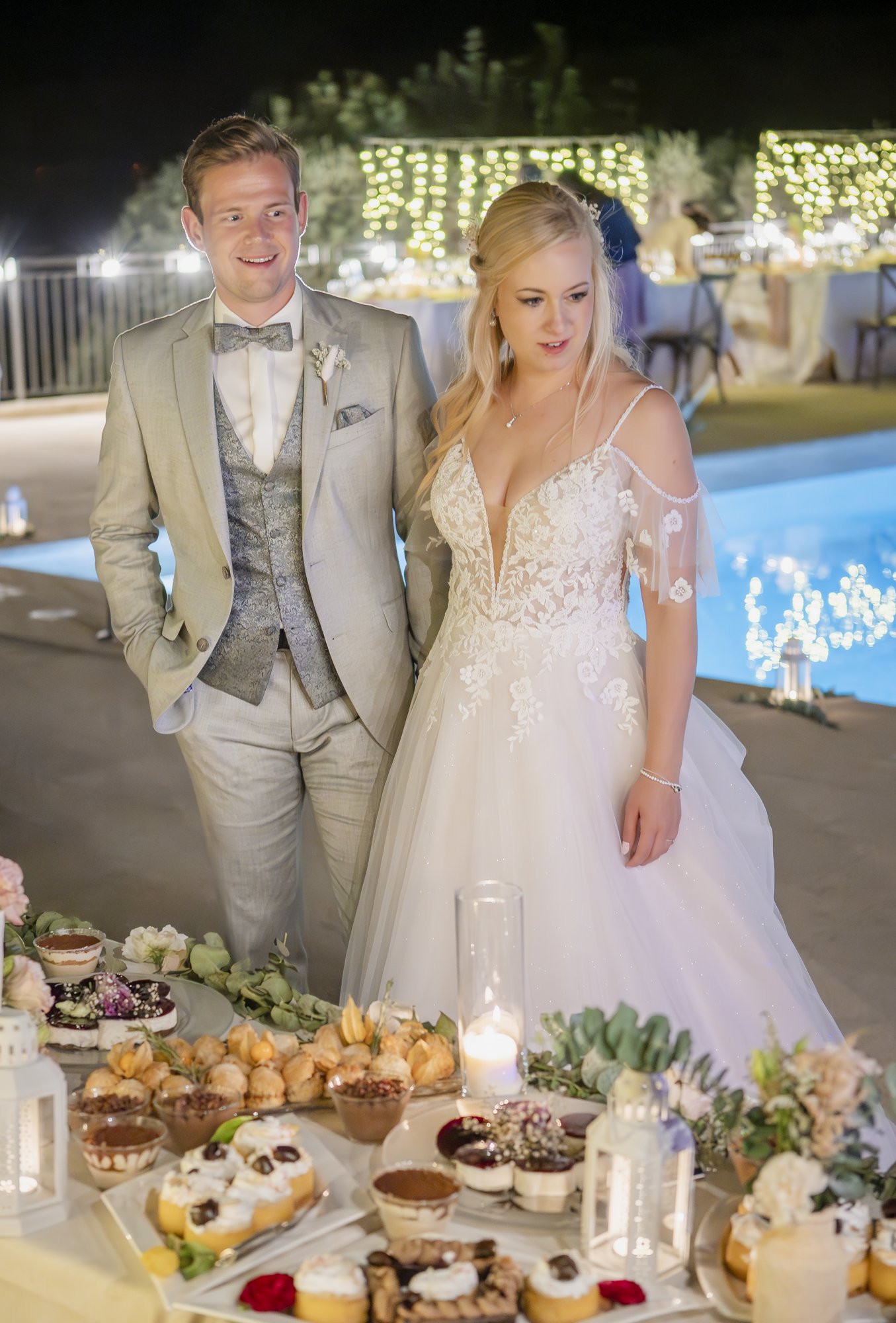 Couple at the sweet table at night, wedding Agua Amarga